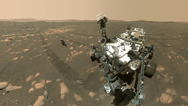 NASA’s Perseverance Mars rover took a selfie with the Ingenuity helicopter, seen here about 13 feet (3.9 meters) from the rover in this image taken April 6, 2021, the 46th Martian day, or sol, of the mission by the WATSON (Wide Angle Topographic Sensor for Operations and eNgineering) camera on the SHERLOC (Scanning Habitable Environments with Raman and Luminescence for Organics and Chemicals) instrument, located at the end of the rovers long robotic arm.